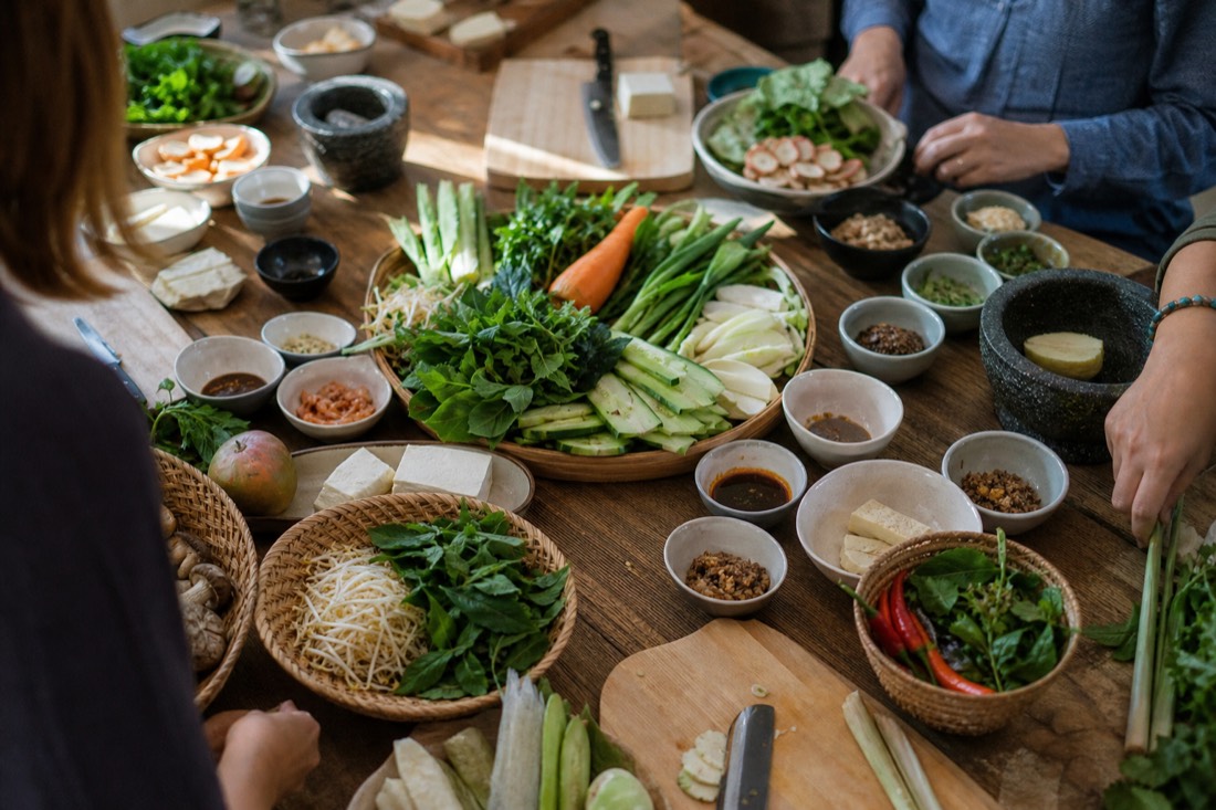 Fresh ingredients laid out on a cooking class table for a market-to-table Hanoi cooking session